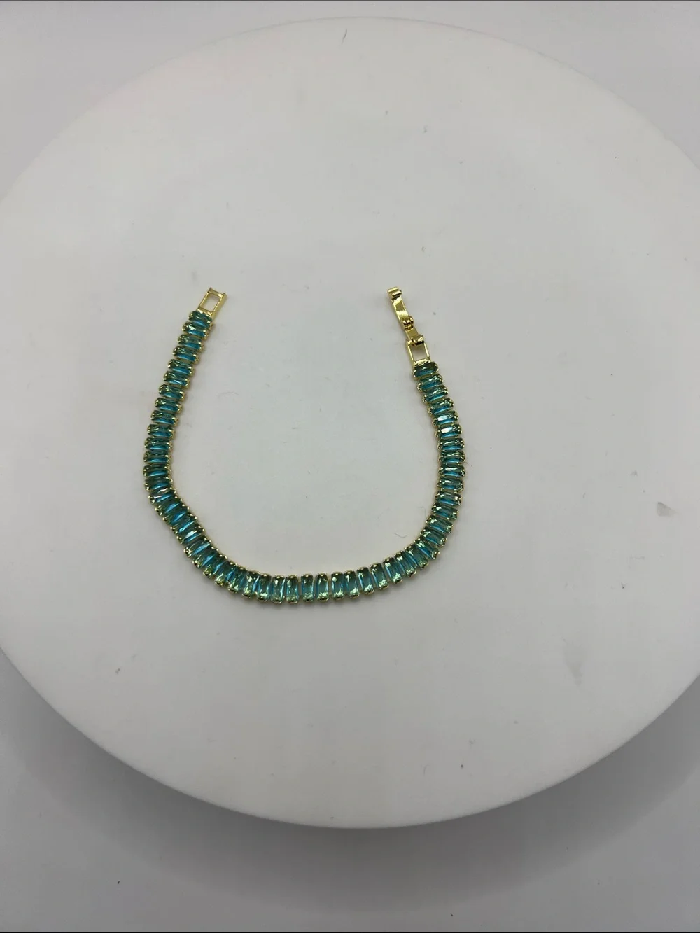 524. 18k Gold Plated over Brass Bracelet with Aquamarine Cubic Zirconias 7”